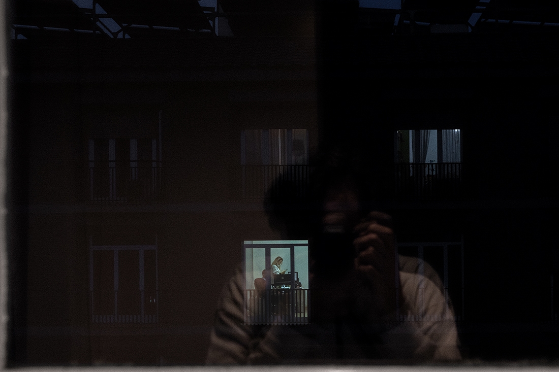 Window overlooking window. Human connection during the lockdown.